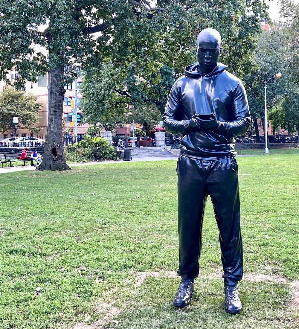 Thomas J. Price's 9-foot sculpture "Witness" arrives in Marcus Garvey Park in Harlem.