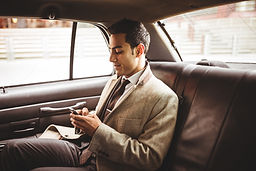 Businessman in a taxi to the airport