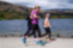 runners by the lake