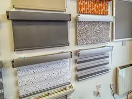 A wall display of blinds in the Bathgate showroom