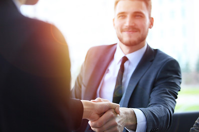 Business people shaking hands, finishing up a meeting_edited.jpg