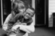 Foster carer hugging a child