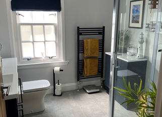 Compact bathroom with toilet and towel rail