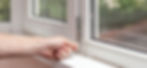 Close up of person working on a uPVC window