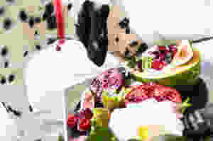 black and white dalmatian dog eating fruits