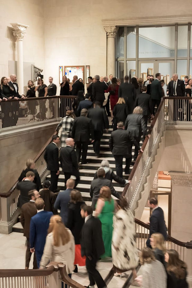 Guests making their way up a staircase