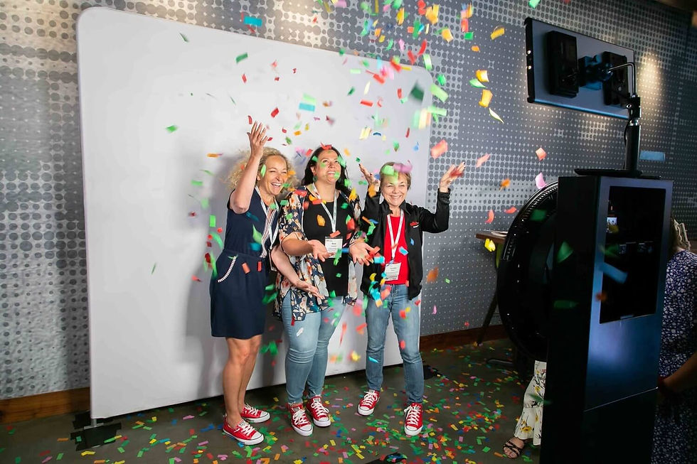 Guests enjoying a photo booth experience at an event