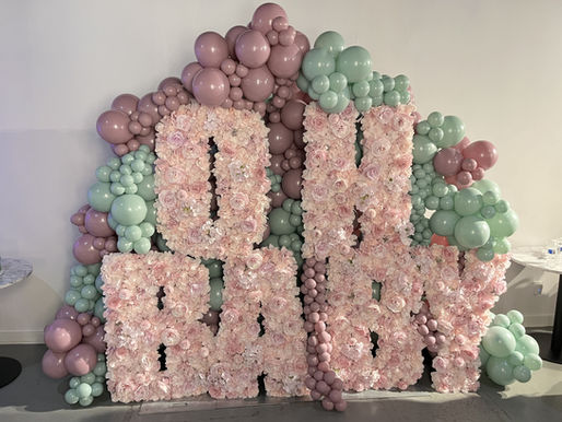 Oh Baby floral letter installation with blush roses and balloon garland at The Fulton West Chicago baby shower venue