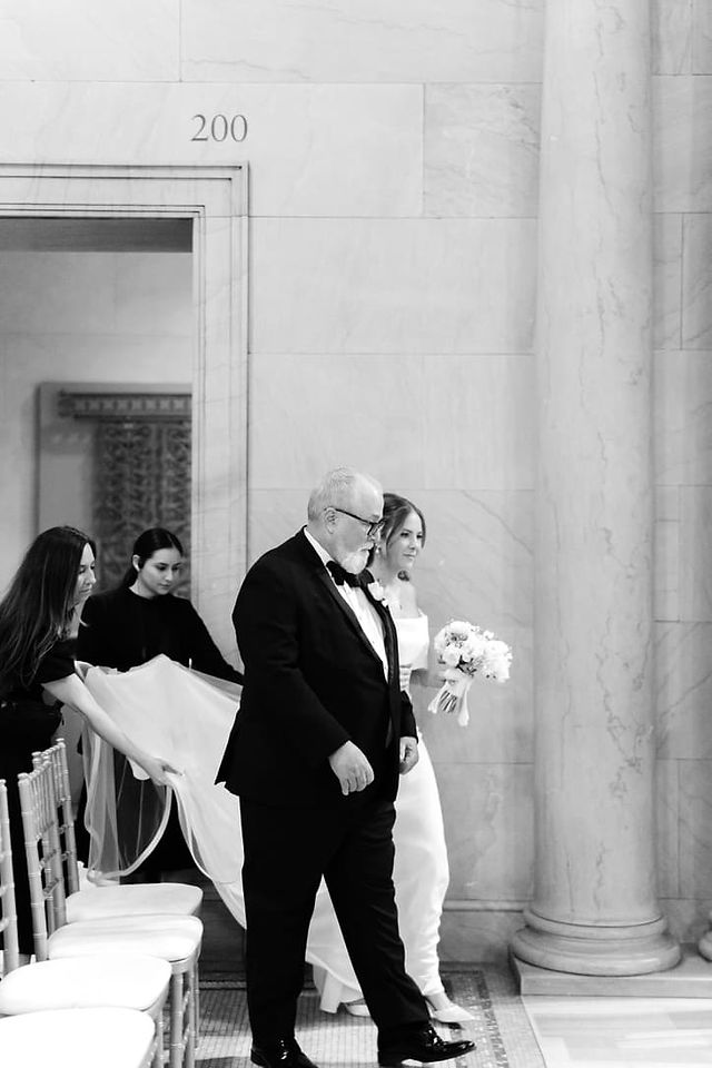 Bride and groom walking hand in hand 