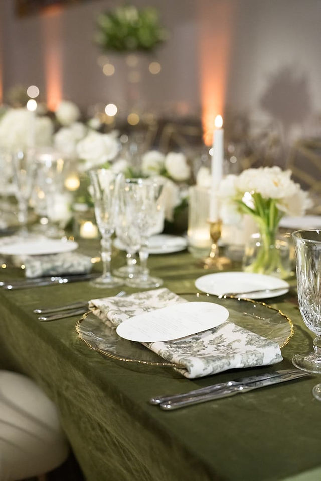 Classy green and white decor on the reception tables