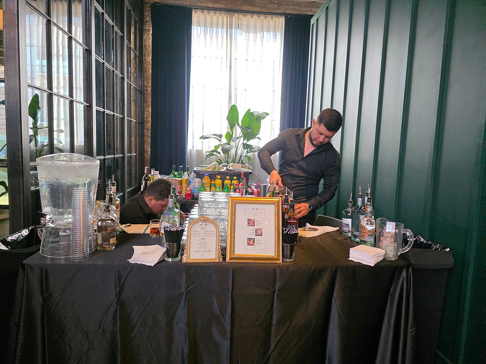 Certified bartenders setting up a mobile bar cart with a full bar menu for an event