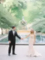 Bride and groom in front of water fountains photographed by Clary Pfeiffer - Clary Pfeiffer Photography - Unity Candle - Wedicity Wedding Day Detailing