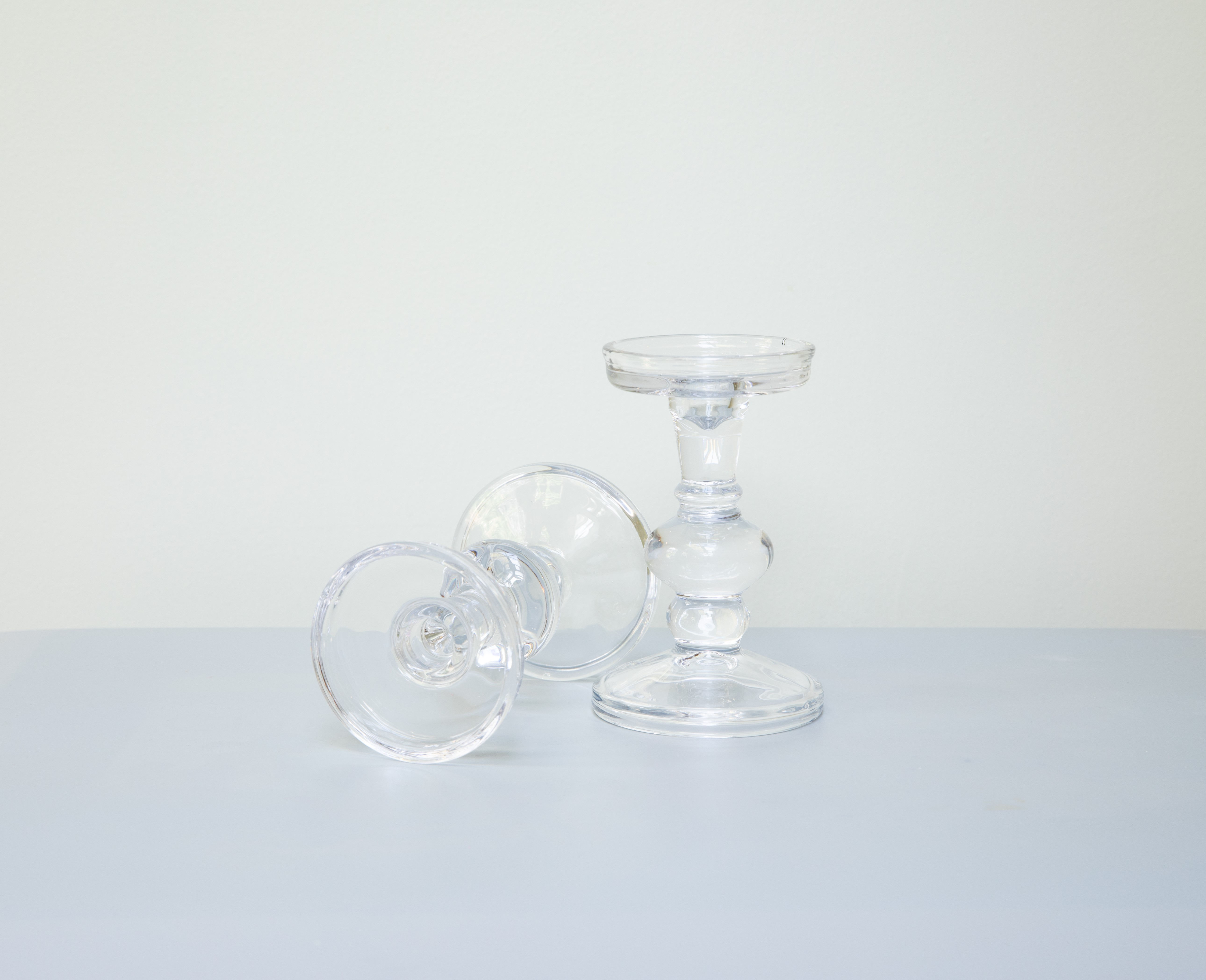 Pair of clear glass candlesticks.