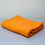 Thumbnail: Orange scarf folded on table.