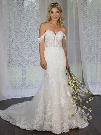 This stunning mermaid wedding dress has a fit and flare skirt, with a gorgeous lace train. The bodice is adorned with beaded lace, and finished with off-the-shoulder straps.