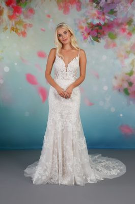 A beautiful blooming floral lace glitter bridal gown with a plunging V-neckline, and beaded straps. The extra sparkly glitter runs throughout the dress and statement lace train, finished with romantic rose lace detailing.