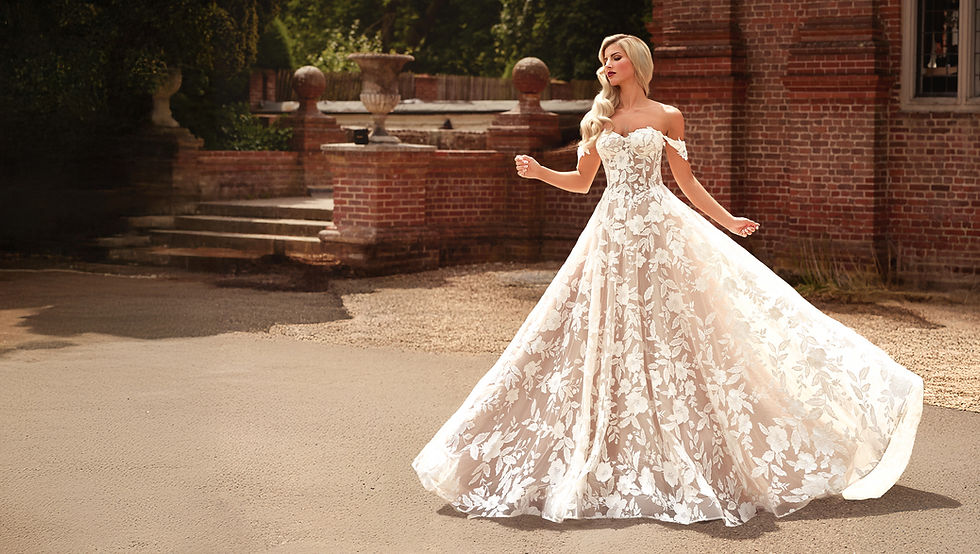 Intricate lace wedding dress in mocha with off the shoulder straps by UK designer