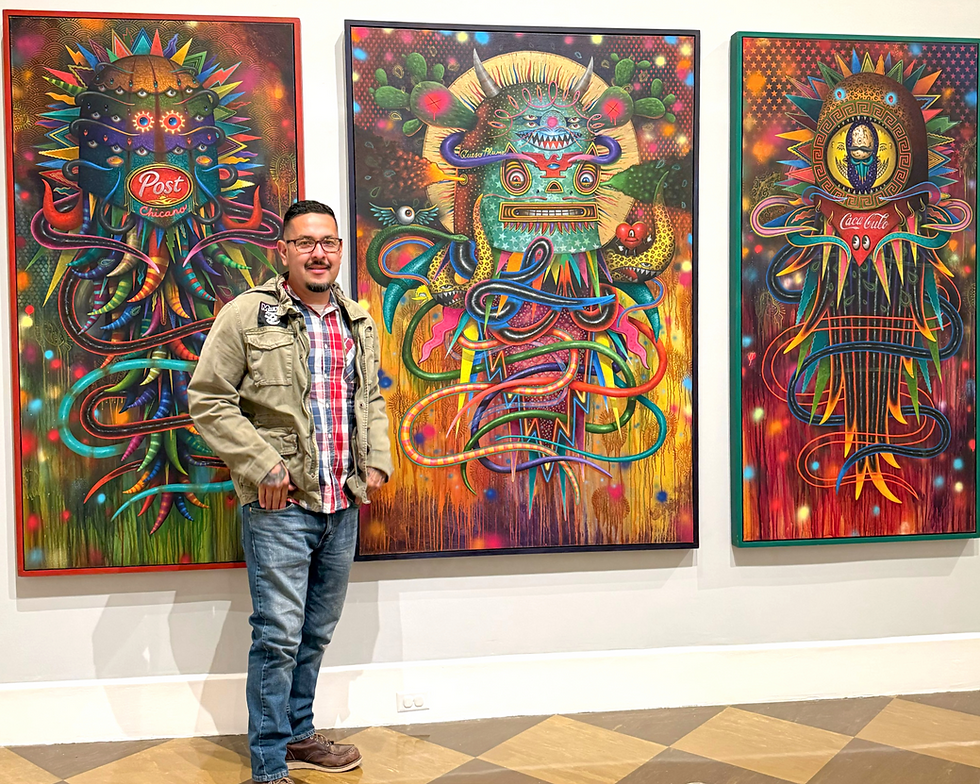 Jaime Zacarias poses with his work "Viva La Lucha." Photo courtesy of Jaime Zacarias