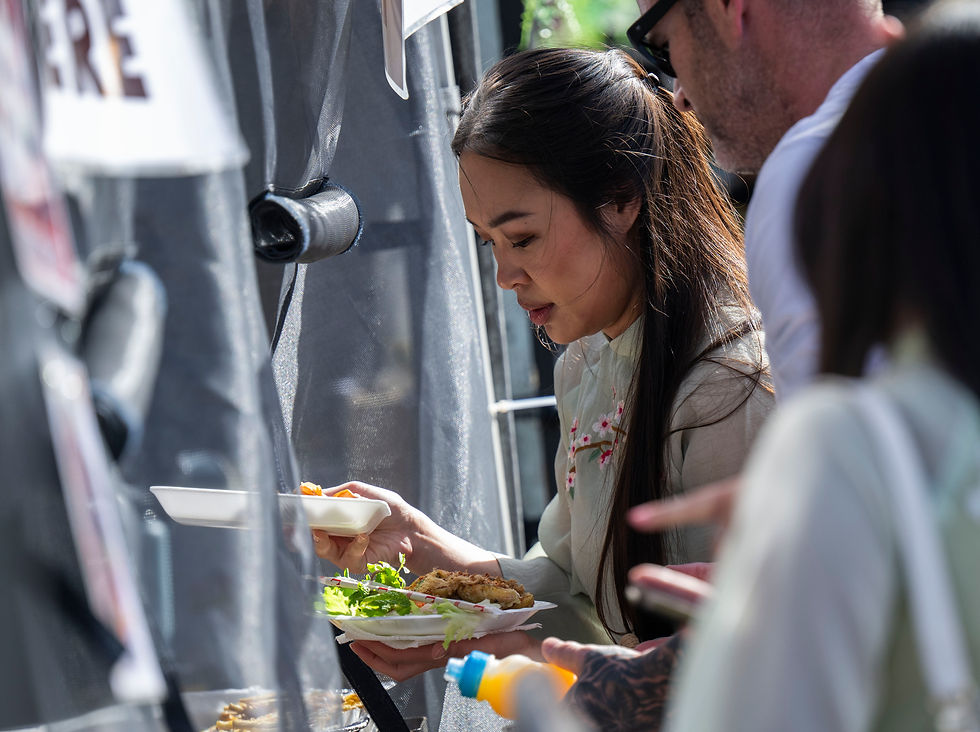 A customer at the food court picks up her order.