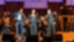 The Three Mexican Tenors perform with the Detroit Symphony Orchestra. They are, from left, Bernardo Bermudez, Jorge Lopez-Yañez and Alfredo Carillo. Enrico Lopez-Yañez conducts. They will perform this weekend with the Pacific Symphony at the Renée and Henry Segerstrom Concert Hall. Photo courtesy of the Detroit Symphony Orchestra