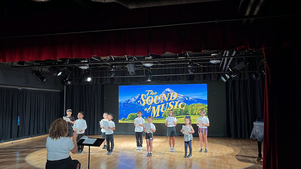 Lyric Opera of Orange County founder Diana Farrell leads RSI students in musical performance learning. Photo courtesy of Renascence School International