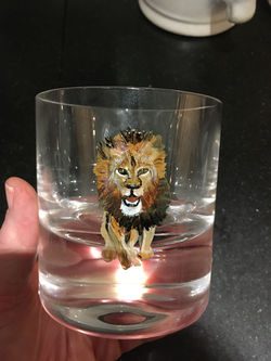 old fashioned glass hand painted with a lion, paint is top rack dishwasher safe