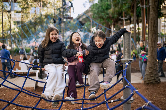 A Lifestyle photo of 3 girls on play equipment
in Darling Harbour, Sydney Australia
