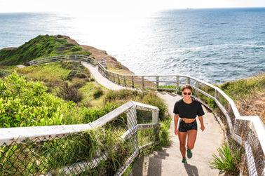 A Lifestyle photo of a woman walking on a scenic path
Time Out and Destination NSW
