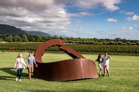 A Lifestyle photo of 4 people looking at an art installation
Time Out and Destination NSW
