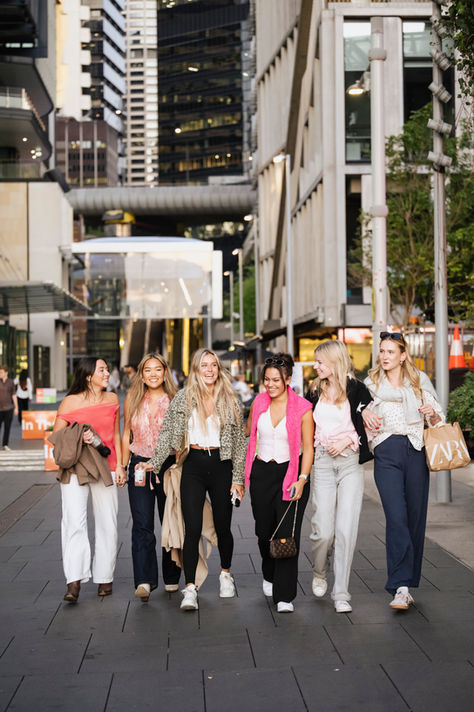 A lifestyle photo of a group of young girls walking in Barangaroo Sydney Australia