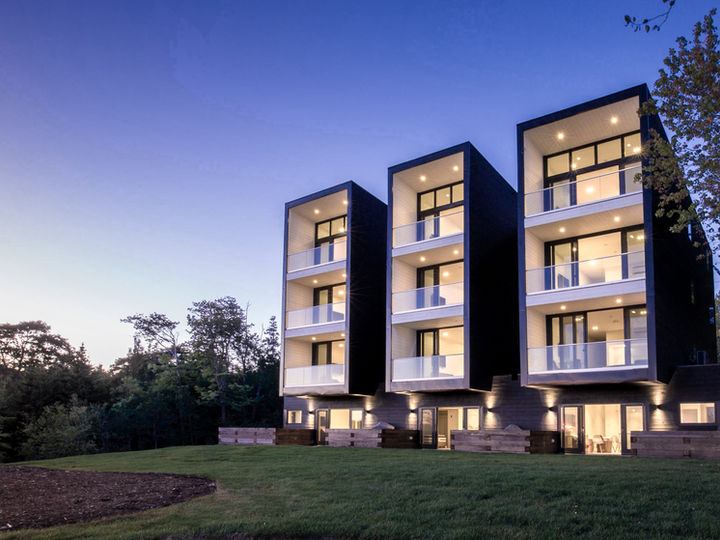 Modern architecture hotel with corrugated metal and horizontal wood boards located in Nova Scotia, designed by Nicholas Fudge Architects. 