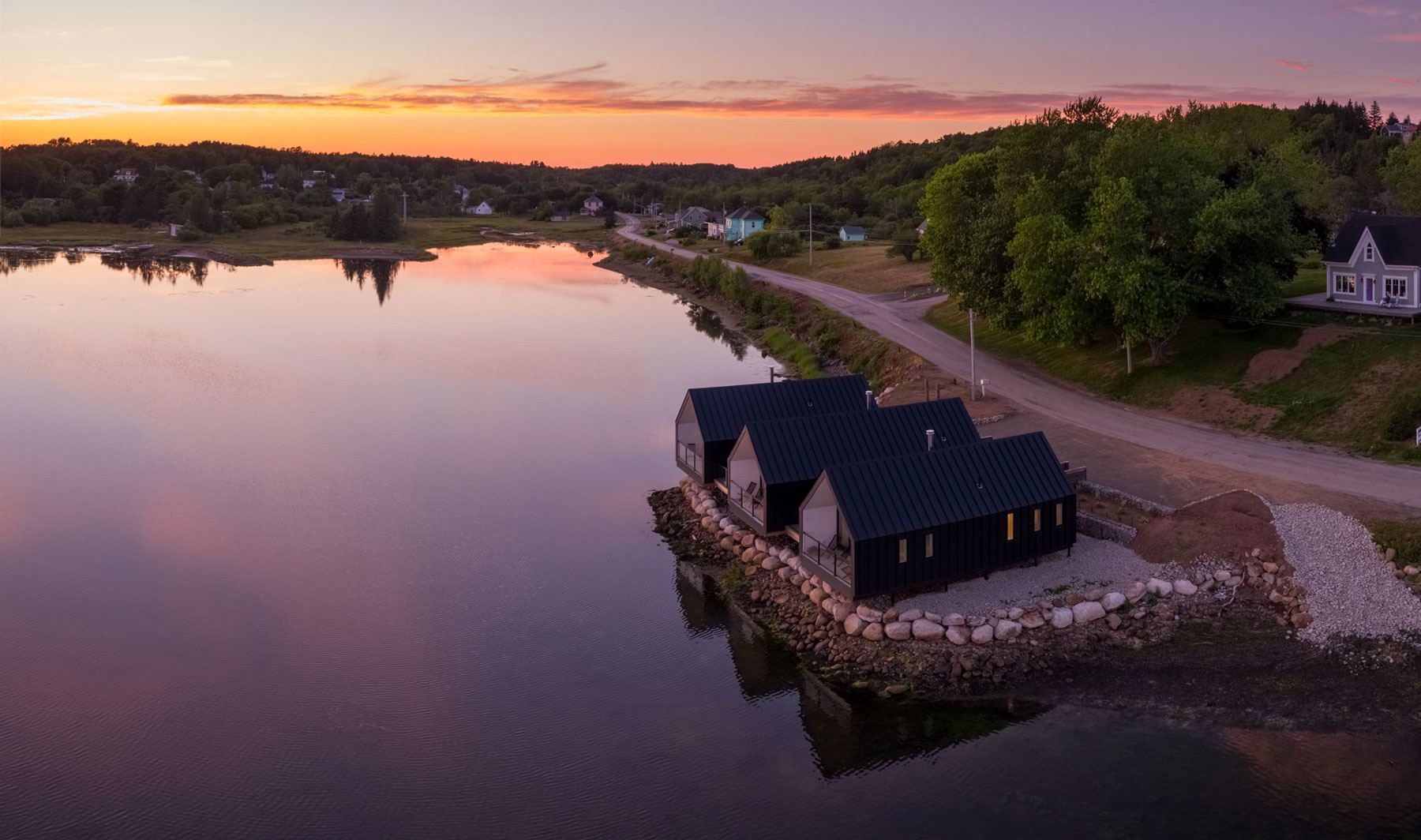 Modern architecture houses on stilts located in Upper South Cove, Nova Scotia designed by Nicholas Fudge Architects.