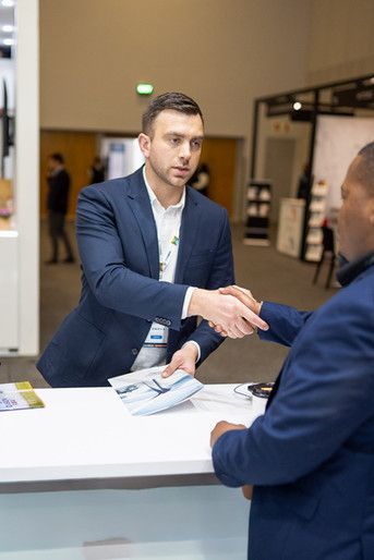 One-on-one professional networking at an expo, captured by an experienced event photographer in Cape Town.
