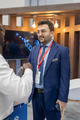 FKK team member in conversation during Mining Indaba 2026 at CTICC