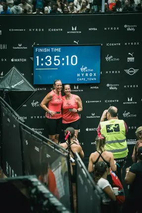 HYROX event photography — finish-line celebration at Virgin Active HYROX Cape Town 2026