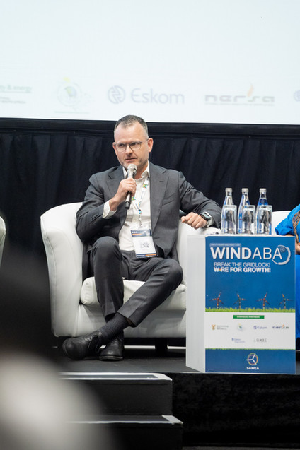 Professional photo of a speaker on stage at a corporate event, suitable for Cape Town event photography portfolios.