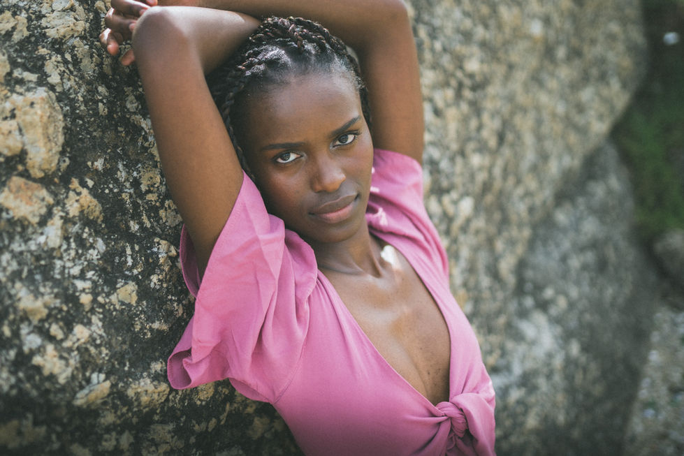 Photo shooting at a Camps Bay Beach in Cape Town with a professional model posing in a bikini. I am a professional Photographer in Cape Town.