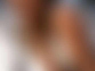 Extreme close-up of a female runner's face showing sweat and determination, captured by a sports photographer Cape Town.