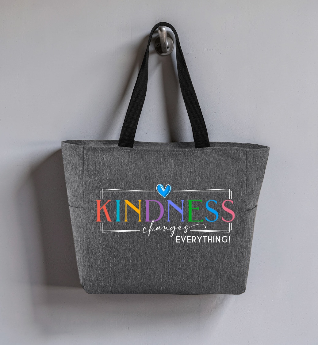 Heather Gray zippered tote hanging on a hook, colorful text reads Kindness changes everything, pastel color scheme