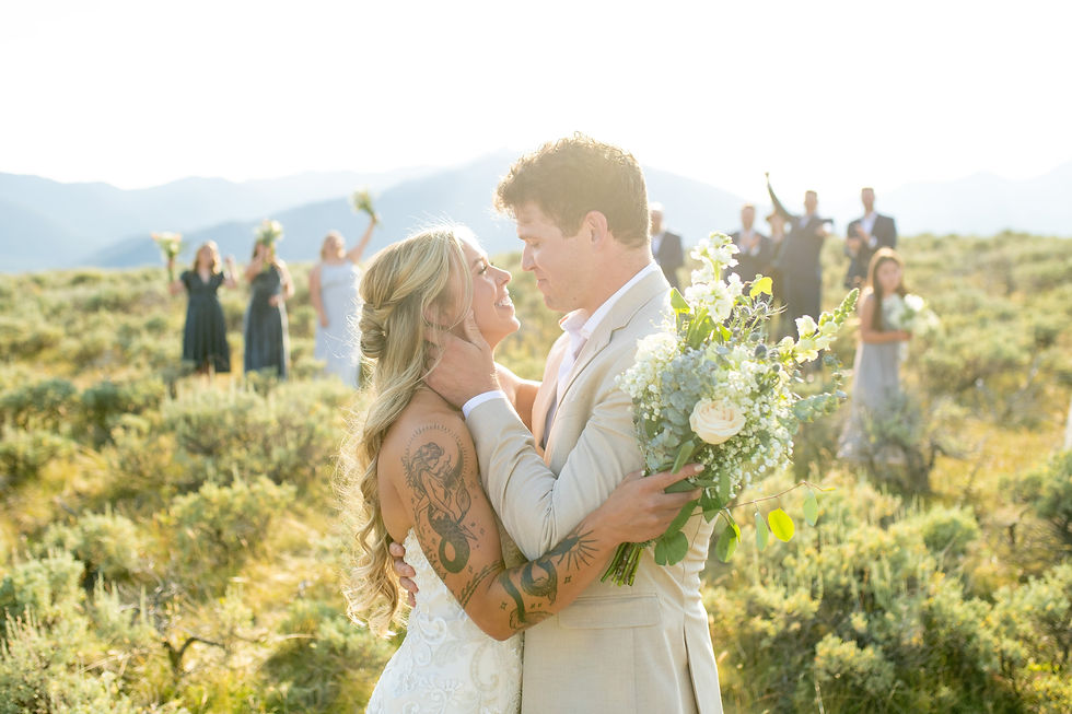 Bride and groom celebrating after elopement ceremony in Cody Wyoming near Yellowstone National Park