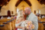 Bride and groom kissing after Mammoth Chapel elopement ceremony in Yellowstone National Park
