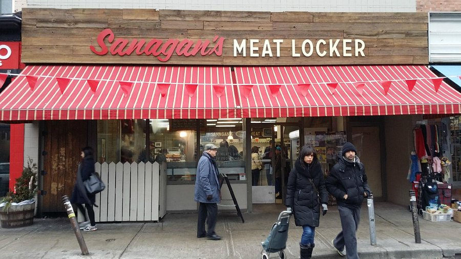 Sanagan’s Meat Locker storefront in Kensington Market Toronto, offering locally sourced meats for BBQ events.