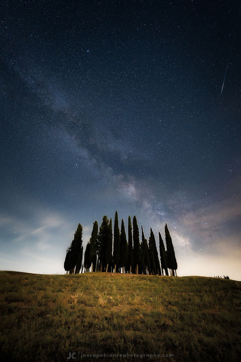 Cypresses under the milkyway. A night photo of Val d'Orcia, Tuscany