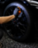Detailer applying ceramic coating for long-term paint protection