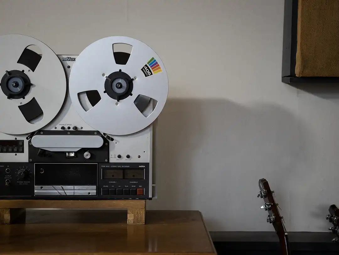 A vintage tape recorder in a recording studio