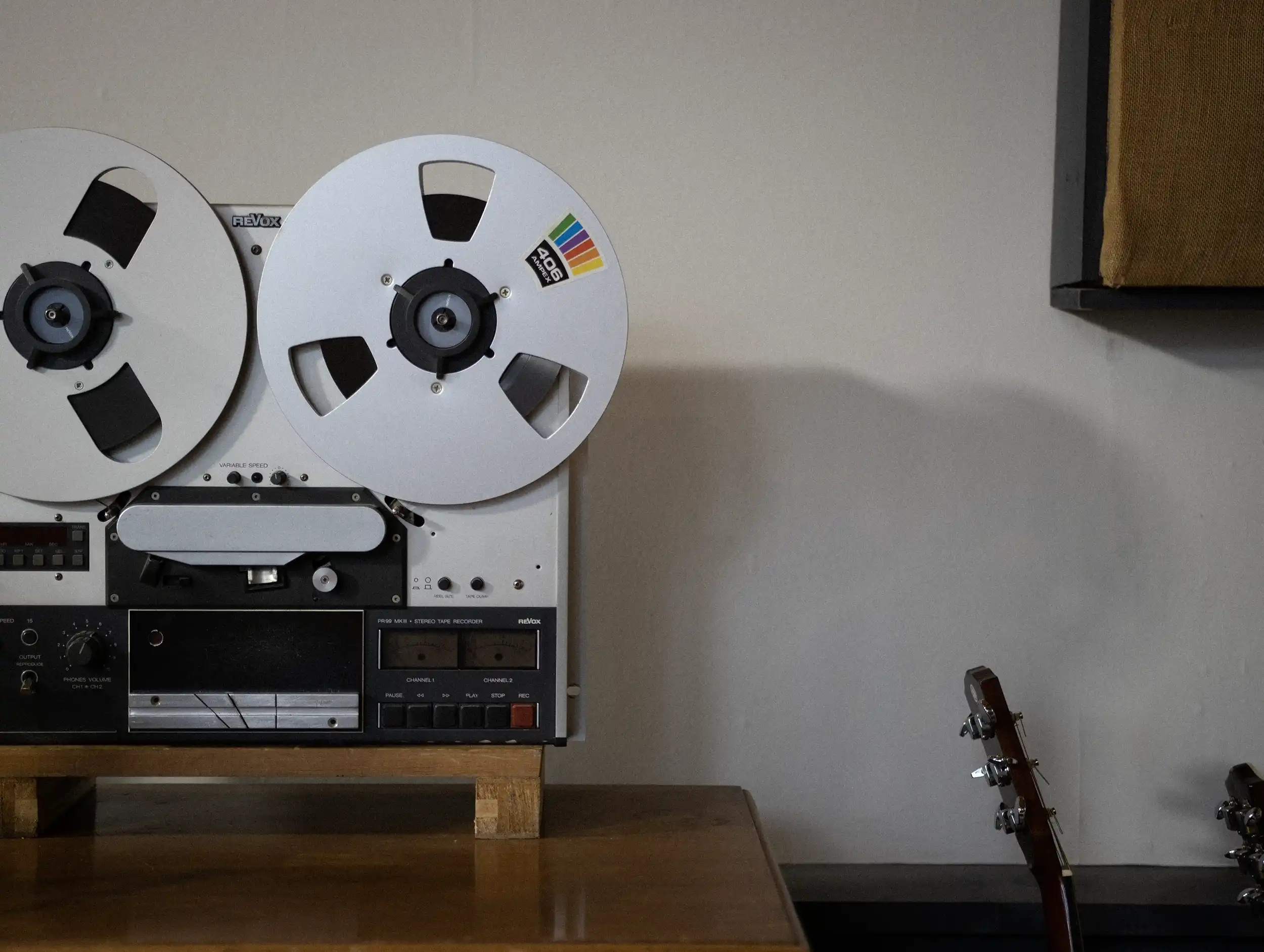 Photograph showing an old tape reel machine in a music studio