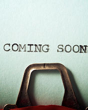 Coming soon text written on a paper..jpg