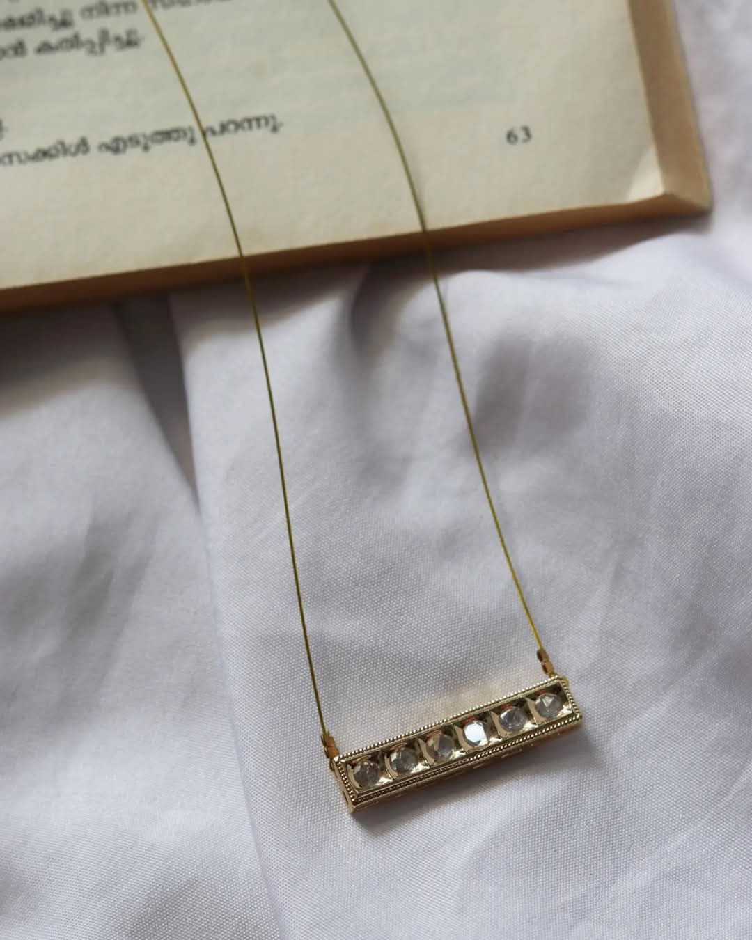 HARINI Invisible Chain with Kundan Pendant