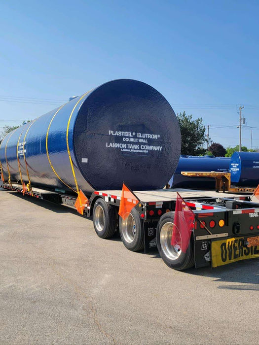 Hauling an Airgas tank on a double drop trailer.