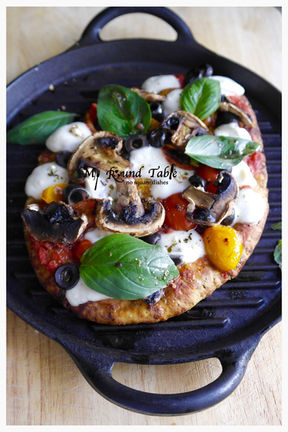 Pizza with Mushrooms, Olives, Tomatoes and Mozzarella
